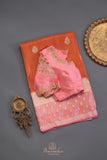 An exquisite Silk Saree in burnt orange and rose pink
