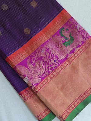 A Royal Gadwal kanchi saree in purple with contrast turning meena border
