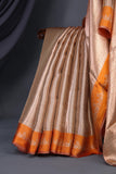 Banarasi brocade tissue saree in champagne with a beautiful light orange border