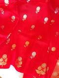 Red organza saree with a contrast blue work blouse