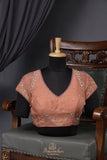 Crushed tissue saree in peach with beautiful cutwork border