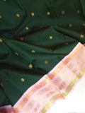 Kanjeevaram saree in bottle green with a baby pink border