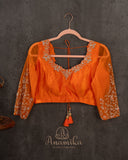 Orange Crush Tissue saree with a stunning net sleeves blouse