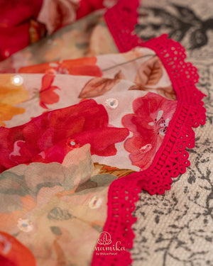 Beige Floral Chinnon saree with a contrast tomato pink handwork blouse