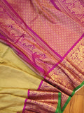 Royal Gadwal kanchiPattu saree in a beautiful parrot green and magenta combination