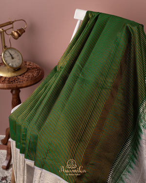 Dark green kanjeevaram saree with contrast grey border and pallu