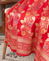 Red Banarasi Saree with a sleeveless blouse