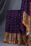 Deep purple bandini saree with a hand painted kalamkari border