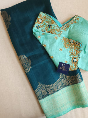 Peacock Green with aqua blue rawsilk saree with a stylish blouse