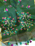 Bottle Green Jamdaani saree paired with a contrast yellow paithani blouse