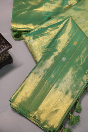 Green Tissue Kanchi saree with a contrast off white blouse