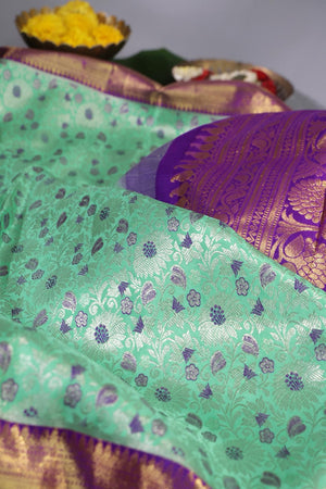Mint Green Kanjeevaram saree with a purple border