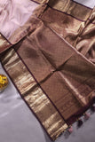 Kanchipattu saree in a lovely shade of light peach with a contrast dark maroon border