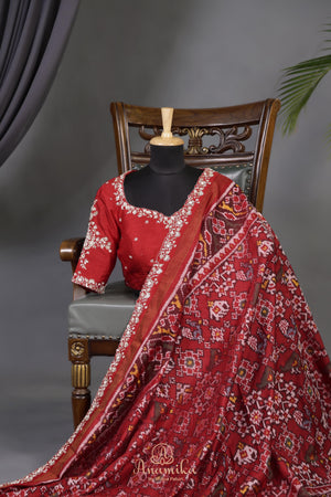 Patan Patola saree with intricately designed maggam work border