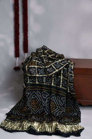 Black Bandini Gharchola saree with a showstopper blouse patter