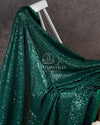 Dark bottle Green georgette sequins saree paired with a stunning blouse and belt