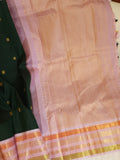 Kanjeevaram saree in bottle green with a baby pink border