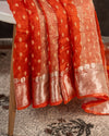 Orange Crush Tissue saree with a stunning net sleeves blouse