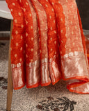 Orange Crush Tissue saree with a stunning net sleeves blouse