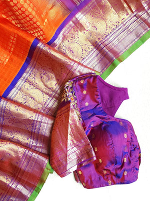 A grand Gadwal Kanchi saree in orange for your joyous occasions