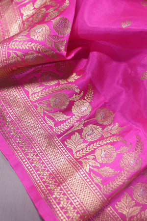 Raw Mango saree in bubble gum pink paired with a contrast dark green blouse
