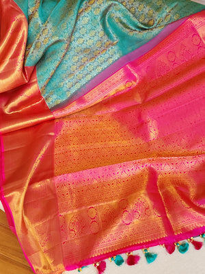 Turquoise Blue kanjeevaram saree with a contrast majenta pink border