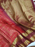 A stunning vintage kanjeevaram in rust orange with a deep maroon border