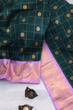 Gadwal pattu saree in the most beautiful dark green and lavender combo