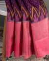 A purple kanchi soft silk saree with peach pink border