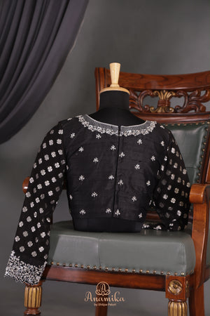 A graceful black Georgette saree with stylish full sleeves blouse