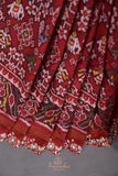 Patan Patola saree with intricately designed maggam work border