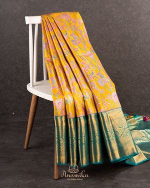 A meenakari kanjeevaram saree in yellow and teal