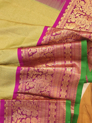 Royal Gadwal kanchiPattu saree in a beautiful parrot green and magenta combination