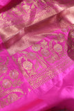 Raw Mango saree in bubble gum pink paired with a contrast dark green blouse