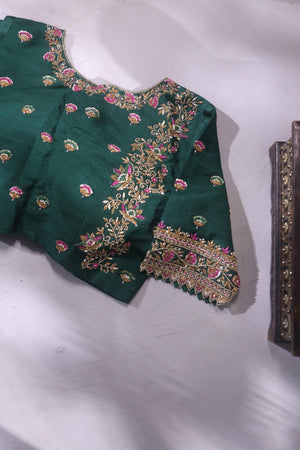 Raw Mango saree in bubble gum pink paired with a contrast dark green blouse