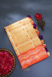 Banarasi Kora silk in a luxurious golden cream and orange border