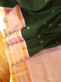 Kanjeevaram saree in bottle green with a baby pink border