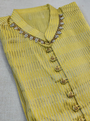 Lovely yellow silk kurta with Zari lines and hand embroidery across the neckline.