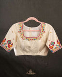Off white blouse with beautifully designed Patola-inspired embroidery