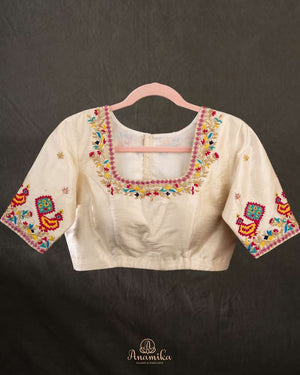 Off white blouse with beautifully designed Patola-inspired embroidery