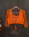 Orange Crush Tissue saree with a stunning net sleeves blouse