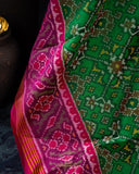 Pure Patola silk saree in a lovely shade of green and pink