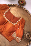 A beautiful vintage kanjeevaram in coppery rust with an ivory border