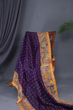 Deep purple bandini saree with a hand painted kalamkari border