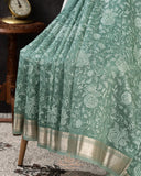 Organza saree in sage green with all over thread embroidery