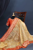 Banarasi Kora silk in a luxurious golden cream and orange border