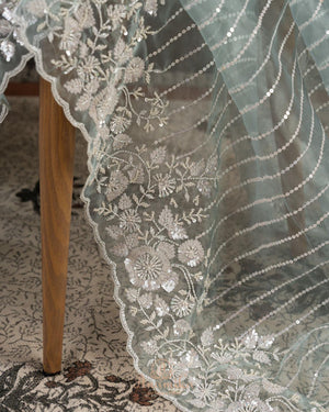 Pastel blue organza saree with all over pearl and sequins work