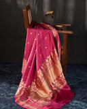 Raw mango pattu saree in a lovely shade of pink paired with a contrast floral blouse