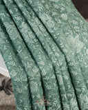 Organza saree in sage green with all over thread embroidery