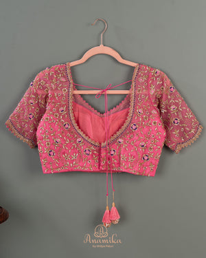 A purple kanchi soft silk saree with peach pink border